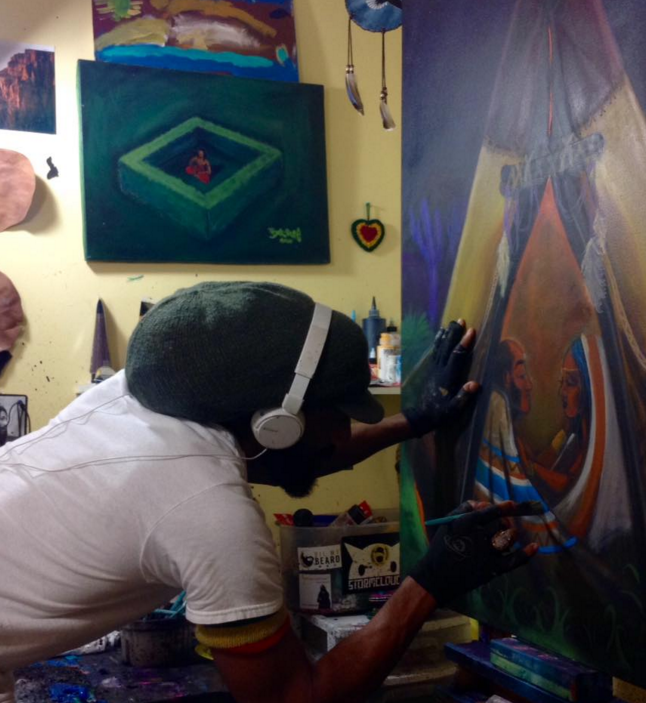 JahSun painting in his studio.